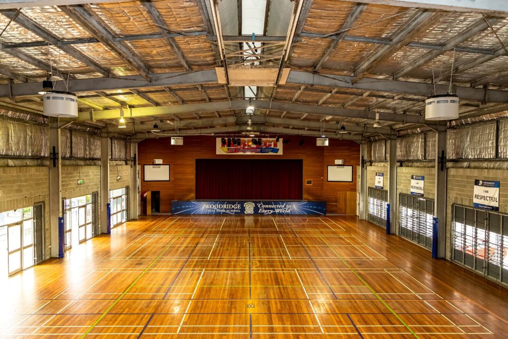 Airius fans providing airflow cooling in a large school gymnasium, Woodridge State High School, Queensland