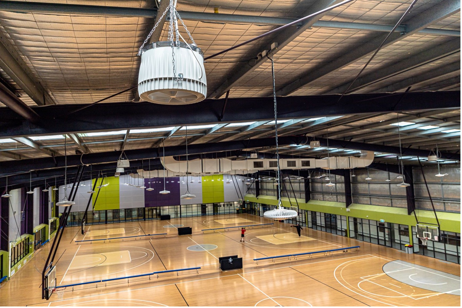 Airius destratification fan installed in a sports hall, improving heating efficiency and occupant comfort.