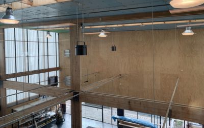 Large warehouse space with Airius destratification fans and high ceilings improving airflow.