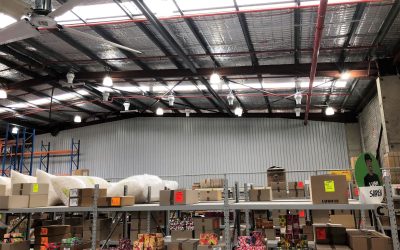 Airius destratification fans in a large warehouse, improving cooling and energy savings.