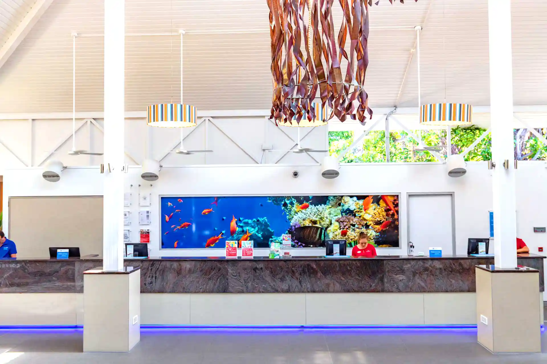 Ramada Inn reception area with Airius fans and aquarium, improving airflow and comfort
