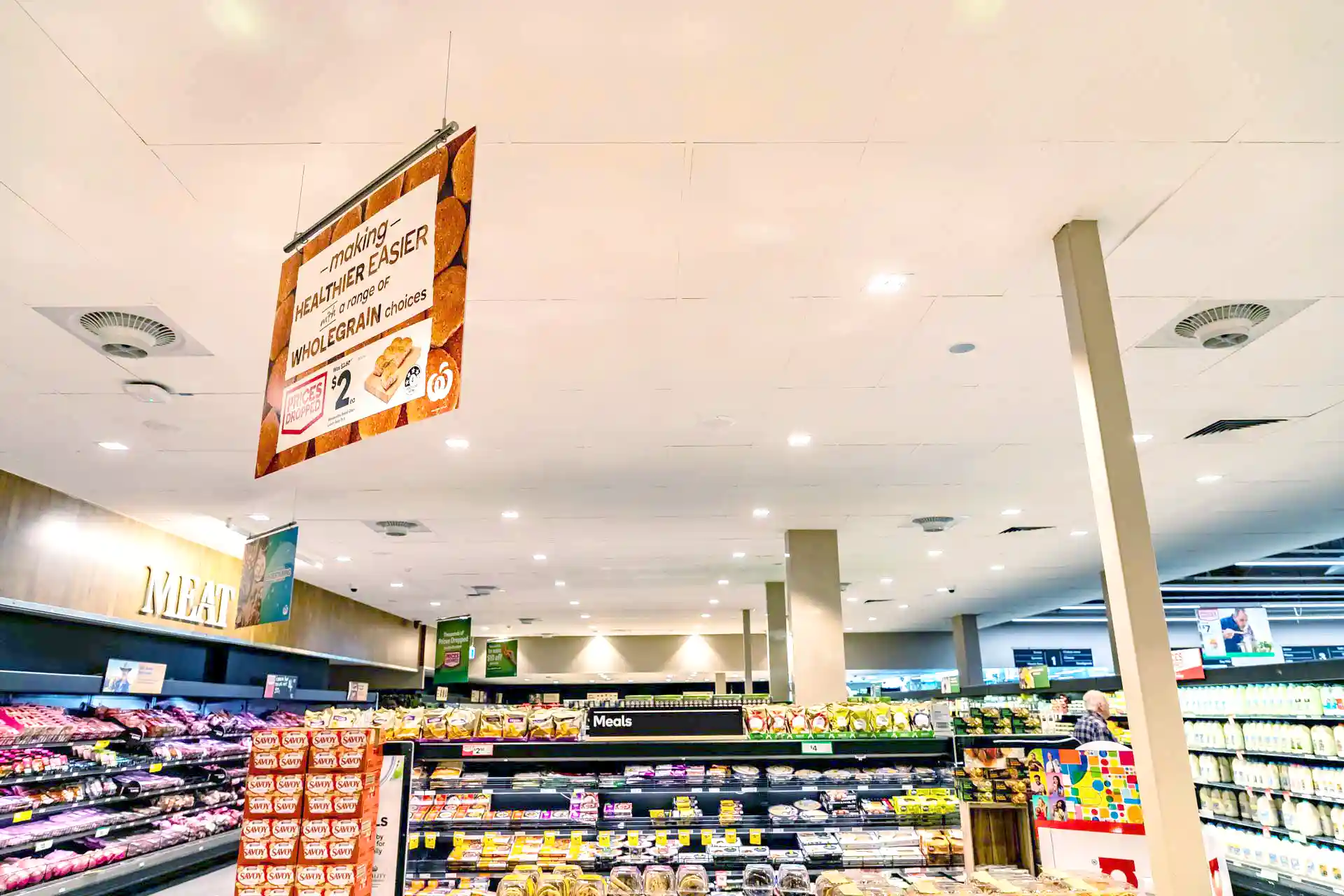 Airius cooling fans installed in supermarket aisle improving air circulation and reducing condensation on display
