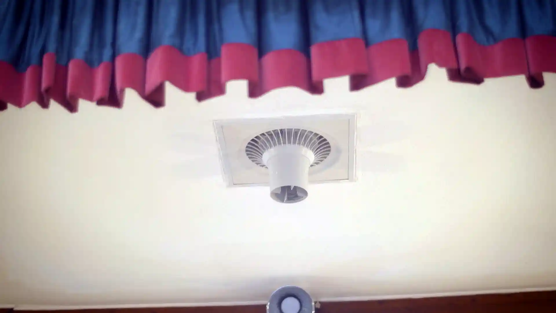 Airius Suspended Series destratification fan installed in Eversley Village Hall ceiling, improving heating effectiveness and