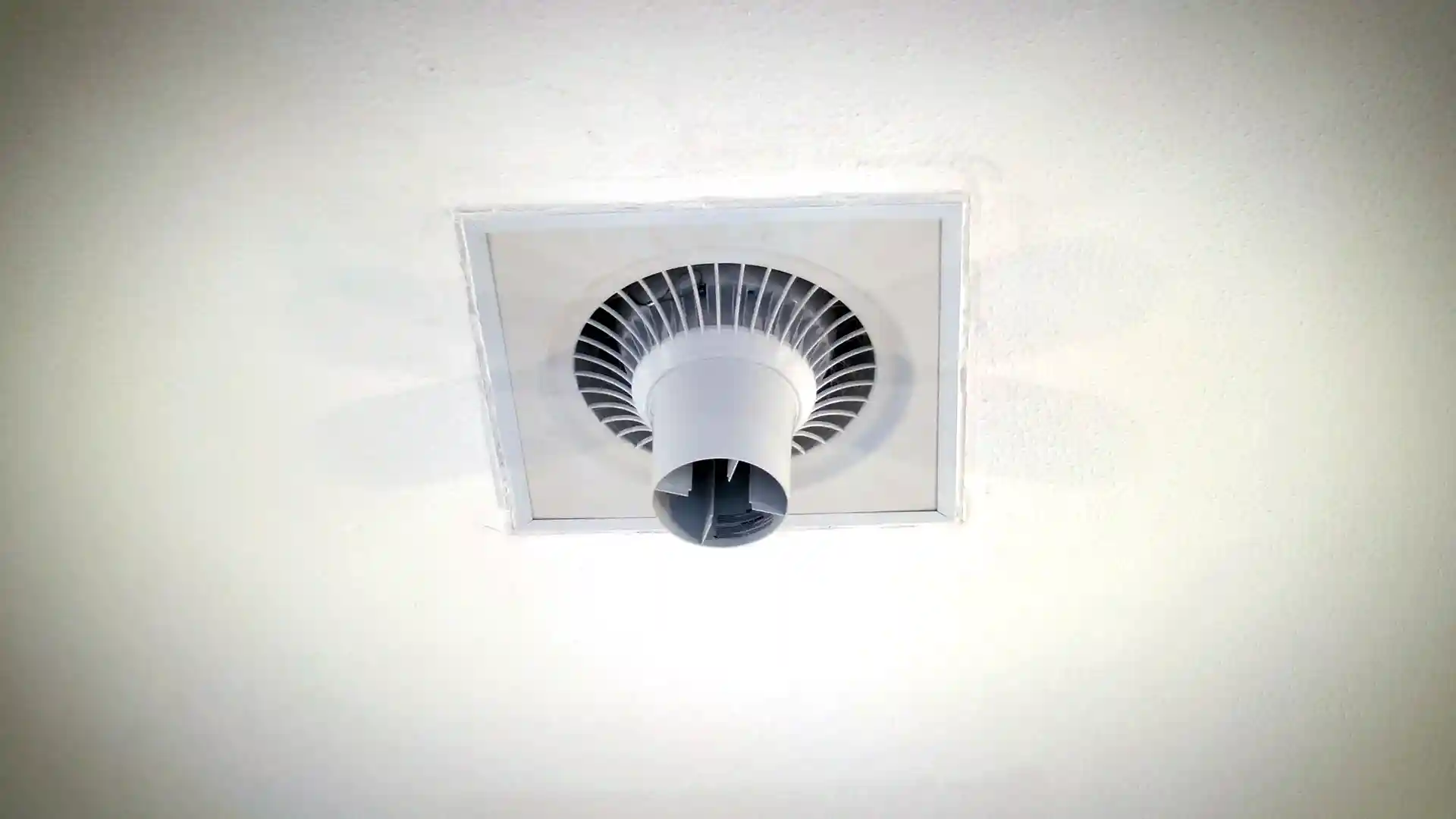 Airius Suspended Series destratification fan installed in Eversley Village Hall ceiling, improving heating effectiveness and
