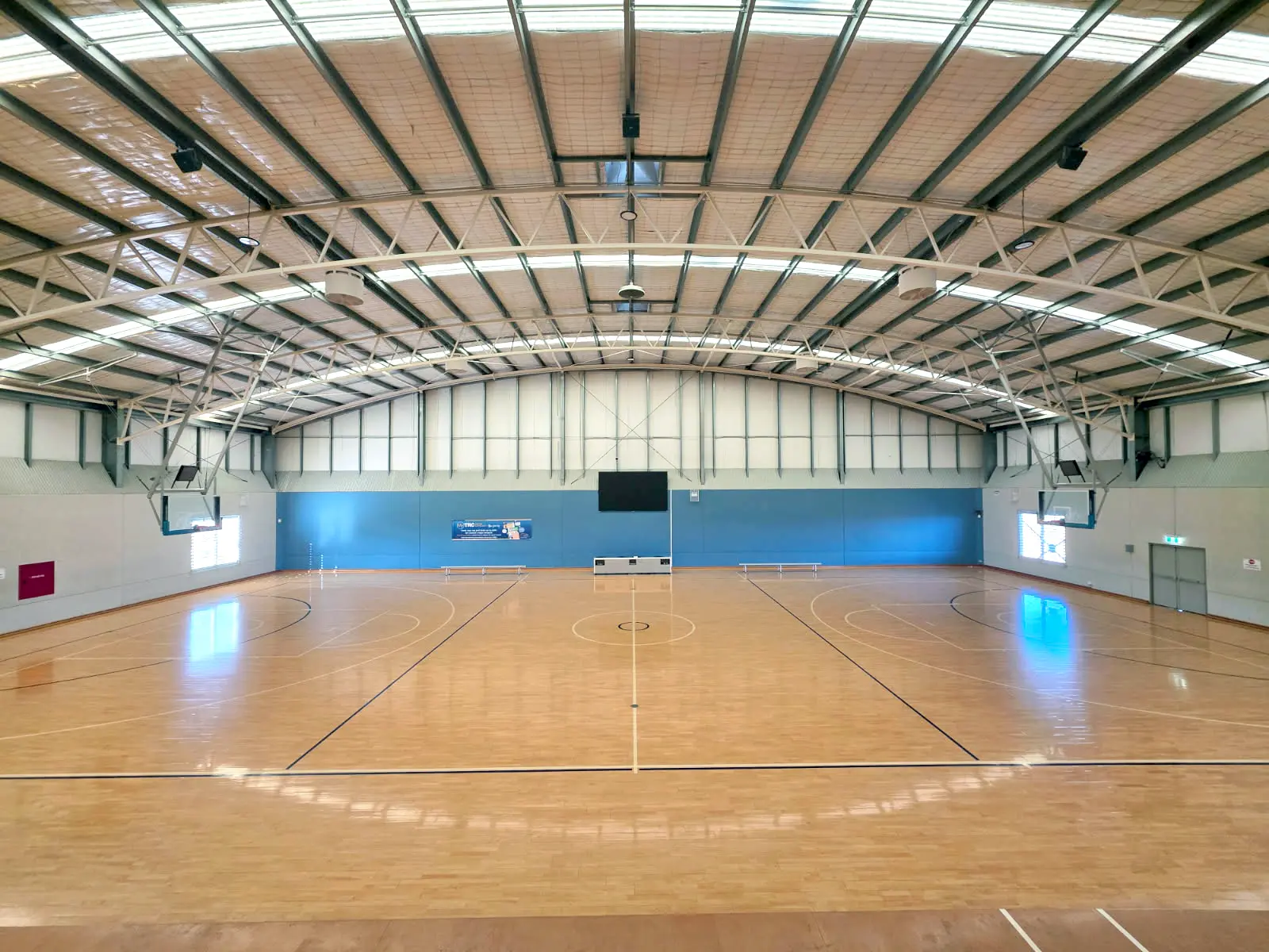 Tamworth Sports Dome indoor basketball court featuring Airius Emerald Series fans for improved air circulation