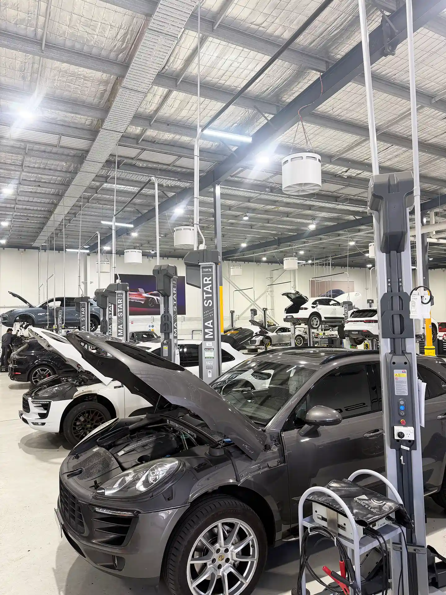 Porsche Centre Sydney South workshop with Airius Emerald 630EC fans providing airflow cooling and destratification.