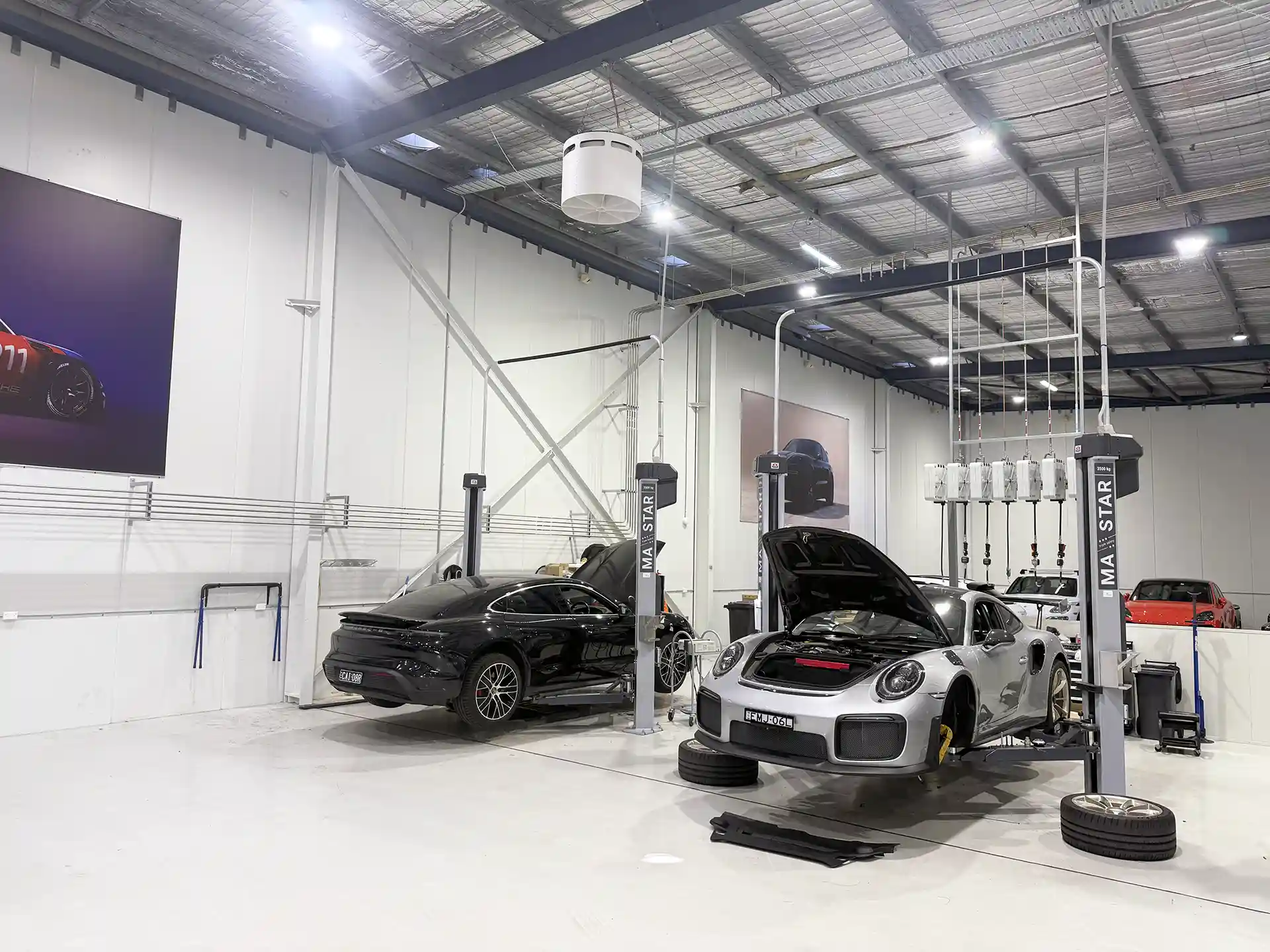 Airius Emerald fan installation in Porsche Centre Sydney South workshop, improving airflow and comfort for