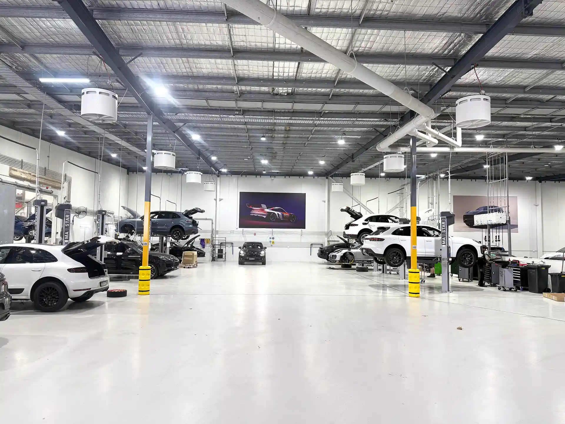 Airius Emerald 630EC fans installed in Porsche Centre Sydney South automotive workshop, improving airflow and