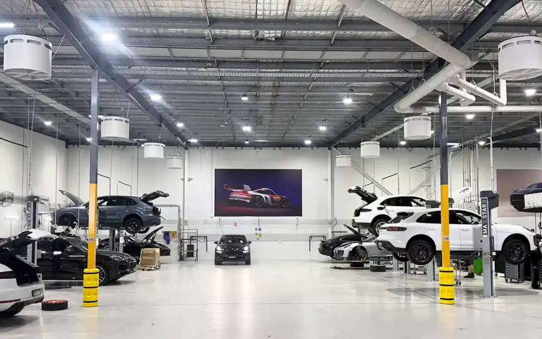 Porsche Centre Sydney South workshop featuring Airius Emerald fans for improved airflow and cooling.
